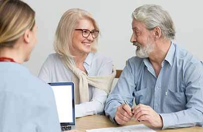 husband and wife consulting with sales rep